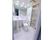 Bathroom with a toilet, sink, vanity mirror and walk in shower at 1900 68Th N St # 104, St Petersburg, FL 33710