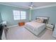Well-lit bedroom with a large bed, wooden chest and view of the window at 1900 68Th N St # 104, St Petersburg, FL 33710