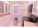 Bright kitchen with white cabinets and stainless steel appliances at 1900 68Th N St # 104, St Petersburg, FL 33710