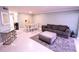 Spacious living area with contemporary furnishings, neutral decor, and tile flooring at 1900 68Th N St # 104, St Petersburg, FL 33710