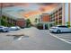 Exterior view of condominium parking area near landscaped grounds at 1900 68Th N St # 104, St Petersburg, FL 33710