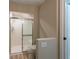 Modern bathroom showcasing tiled shower with glass door, toilet and neutral paint at 2105 Clover Hill Rd, Palm Harbor, FL 34683