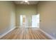 Generous bedroom with wood-look floors, neutral walls and ample closet space at 2105 Clover Hill Rd, Palm Harbor, FL 34683