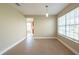 Inviting dining area with tile flooring and a modern pendant light fixture at 2105 Clover Hill Rd, Palm Harbor, FL 34683