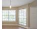 Bright dining area featuring tile floors and a modern pendant light at 2105 Clover Hill Rd, Palm Harbor, FL 34683