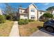 A bright daytime view of home showing its well-maintained exterior and inviting landscape at 2105 Clover Hill Rd, Palm Harbor, FL 34683