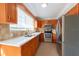 Modern kitchen with stainless steel appliances and stone countertops create a stunning space at 2105 Clover Hill Rd, Palm Harbor, FL 34683