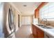 Modern kitchen with stainless steel appliances and stone countertops create a stunning space at 2105 Clover Hill Rd, Palm Harbor, FL 34683