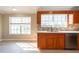 Sunlit kitchen shows ample countertop space and stainless-steel appliances for easy food preparation at 2105 Clover Hill Rd, Palm Harbor, FL 34683