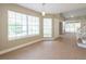 Bright living room featuring large windows and an open floor plan, great for entertaining guests at 2105 Clover Hill Rd, Palm Harbor, FL 34683
