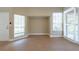 Bright and airy living room featuring tile flooring and multiple windows for natural light at 2105 Clover Hill Rd, Palm Harbor, FL 34683