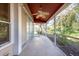 Screened-in patio with a view of the backyard at 2105 Clover Hill Rd, Palm Harbor, FL 34683
