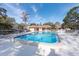 Community pool area surrounded by lounge chairs, perfect for relaxation and enjoyment at 2105 Clover Hill Rd, Palm Harbor, FL 34683