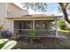 A closer view of the screened patio offering privacy and an enhanced outdoor living experience at 2105 Clover Hill Rd, Palm Harbor, FL 34683