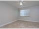 Bright bedroom featuring a ceiling fan and a large window at 2207 S Carolina Ave # 16, Tampa, FL 33629