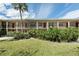 Inviting multi-Gathering exterior featuring a well-manicured lawn, mature landscaping, and a classic facade at 2207 S Carolina Ave # 16, Tampa, FL 33629