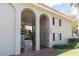 Multi-Gathering exterior featuring stucco arches, black shutters, and a well-maintained lawn at 2207 S Carolina Ave # 16, Tampa, FL 33629