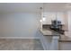 Kitchen featuring stainless steel appliances, a breakfast bar with granite counters, and modern pendant lighting at 2207 S Carolina Ave # 16, Tampa, FL 33629