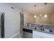 Kitchen with stainless steel refrigerator and gray granite countertops at 2207 S Carolina Ave # 16, Tampa, FL 33629