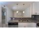 Kitchen with stainless steel dishwasher and gray granite countertops at 2207 S Carolina Ave # 16, Tampa, FL 33629