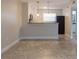 A kitchen featuring stainless steel appliances, a breakfast bar, and modern pendant lighting at 2207 S Carolina Ave # 16, Tampa, FL 33629