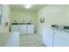 Laundry room with multiple washer and dryer units at 2207 S Carolina Ave # 16, Tampa, FL 33629