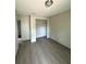 Bedroom with gray walls and dark floors featuring a closet at 2222 E Emma Street, Tampa, FL 33610