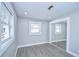 Comfortable bedroom with mirror closet, laminate floors, fresh paint and a window at 245 58Th N St, St Petersburg, FL 33710