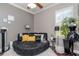 Bedroom featuring a unique circular couch, decorative touches and plenty of natural light at 27045 Firebush Dr, Wesley Chapel, FL 33544