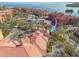 Aerial view of condos near a waterway and bridge showing well-maintained landscaping and ample parking at 2722 Via Tivoli # 430A, Clearwater, FL 33764