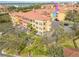 Aerial view of multi-story condos showcasing the community's ample parking and manicured landscaping at 2722 Via Tivoli # 430A, Clearwater, FL 33764