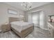 Bright bedroom features a large window, neutral walls, and wood-look floors, creating a serene atmosphere at 2722 Via Tivoli # 430A, Clearwater, FL 33764