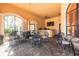 Interior lounge area of community clubhouse with tables, chairs, TV, and bar at 2722 Via Tivoli # 430A, Clearwater, FL 33764