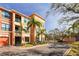Lovely exterior elevation with palm trees, manicured lawns, and a beautiful sky at 2722 Via Tivoli # 430A, Clearwater, FL 33764