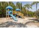 Brightly colored playground featuring slides, climbing structures, and a sandy play area at 2722 Via Tivoli # 430A, Clearwater, FL 33764