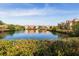 Beautiful pond reflecting the surrounding community buildings on a clear, sunny day at 2722 Via Tivoli # 430A, Clearwater, FL 33764