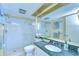 Bright bathroom featuring a glass shower enclosure and a green granite vanity top at 29230 Bay Hollow Dr # 3274, Wesley Chapel, FL 33543