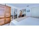Bright bedroom view with a large wardrobe and desk, connecting to living room at 29230 Bay Hollow Dr # 3274, Wesley Chapel, FL 33543