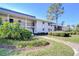 Well-maintained condominium building with manicured landscaping and a welcoming entrance at 29230 Bay Hollow Dr # 3274, Wesley Chapel, FL 33543