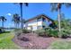 Two-story condo building with clean lines and surrounded by palm trees and well-kept landscaping at 29230 Bay Hollow Dr # 3274, Wesley Chapel, FL 33543