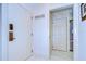 Inviting foyer with tile flooring and white walls leading to the kitchen and rooms at 29230 Bay Hollow Dr # 3274, Wesley Chapel, FL 33543