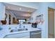 Bright kitchen featuring stainless steel appliances and a convenient pass-through to the living area with a view at 29230 Bay Hollow Dr # 3274, Wesley Chapel, FL 33543