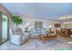The living room features comfortable seating, natural lighting, and a seamless flow to the dining area at 29230 Bay Hollow Dr # 3274, Wesley Chapel, FL 33543