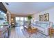 The living room is well-lit, with sliding door access to a scenic balcony and comfortable seating at 29230 Bay Hollow Dr # 3274, Wesley Chapel, FL 33543