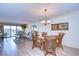 Open living area featuring a seating area with balcony access and views, and a connected dining space at 29230 Bay Hollow Dr # 3274, Wesley Chapel, FL 33543