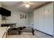 The bonus room includes a television, a reformer and a pull down bed at 3089 Enisglen Dr, Palm Harbor, FL 34683
