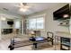 This bonus room includes a television, a reformer and a mirrored closet at 3089 Enisglen Dr, Palm Harbor, FL 34683