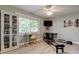 This bonus room includes a pull down bed, television, and a reformer at 3089 Enisglen Dr, Palm Harbor, FL 34683