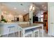 Open-concept design with kitchen, dining area, and living room, perfect for entertaining and relaxation at 3089 Enisglen Dr, Palm Harbor, FL 34683