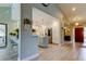 Open kitchen with white cabinets, a center island, and a breakfast bar with seating at 3089 Enisglen Dr, Palm Harbor, FL 34683